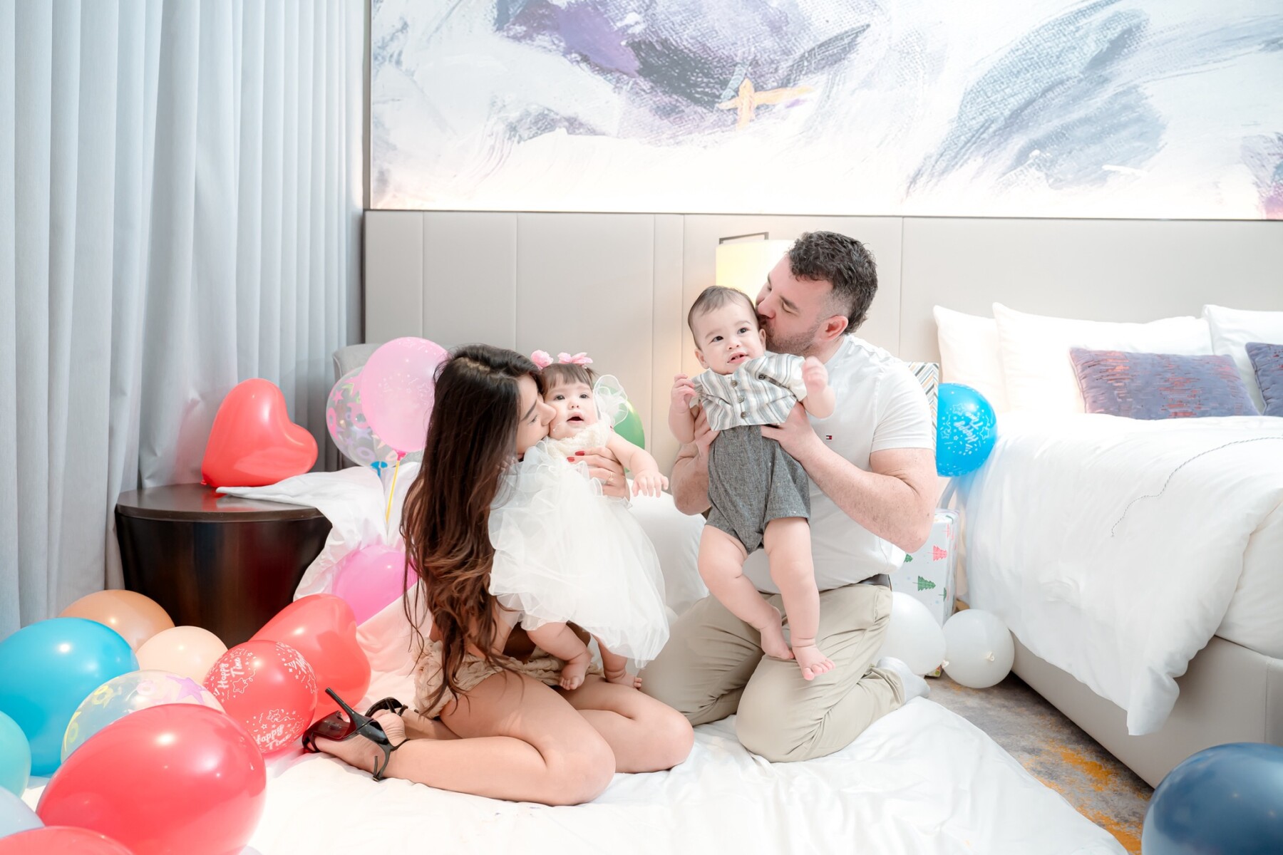Airada and Bart kissing twins at family birthday party