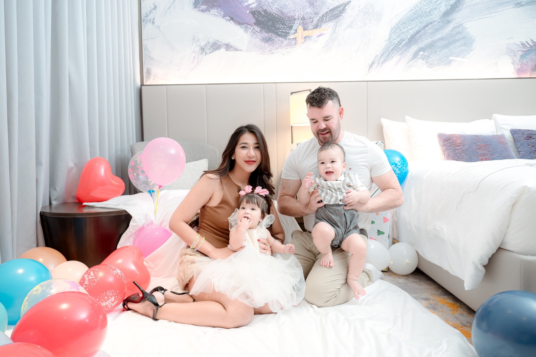 Family group photo with twins during birthday celebration