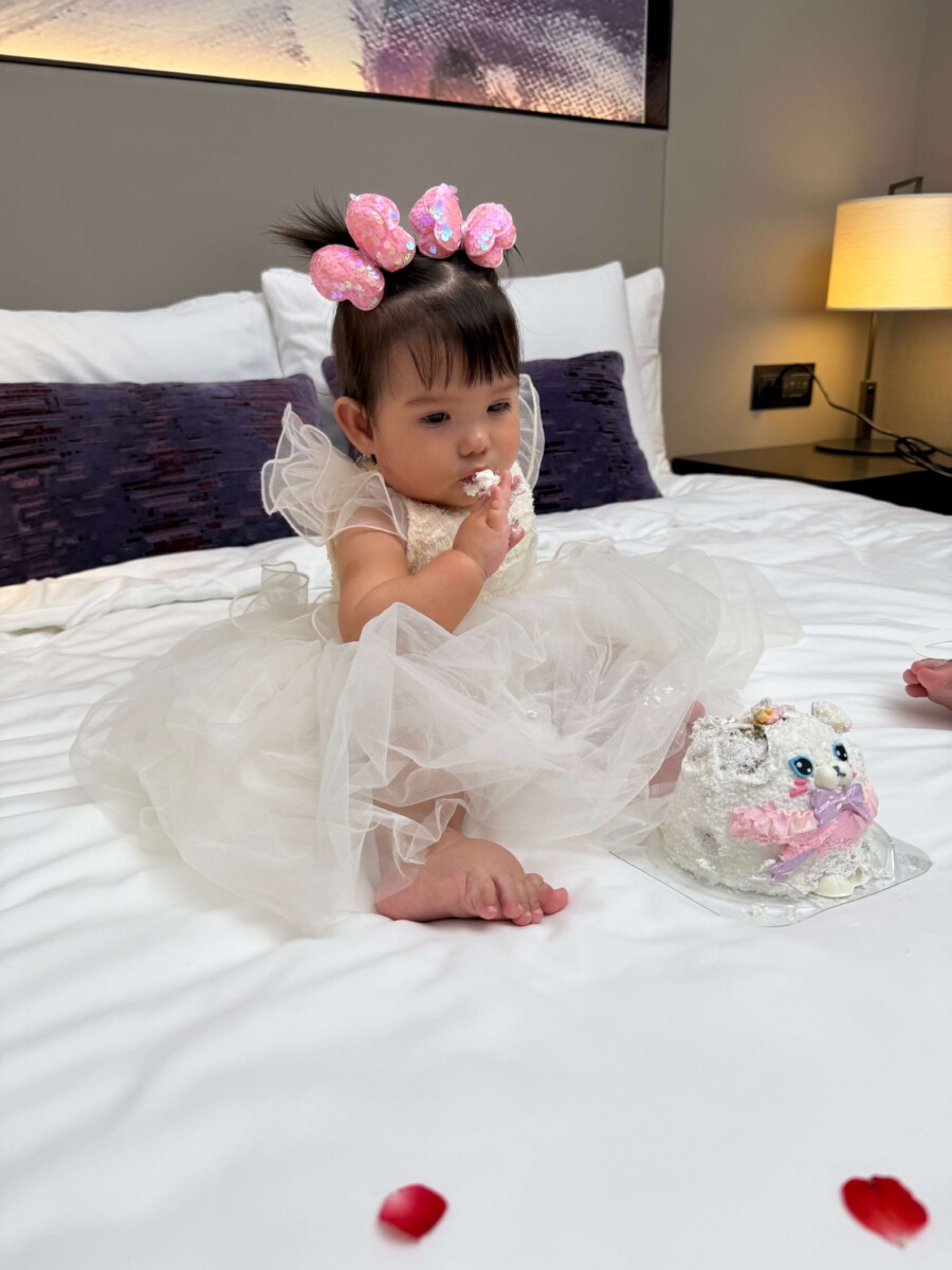 Bart Scanlon daughter Trudy sitting on the bed