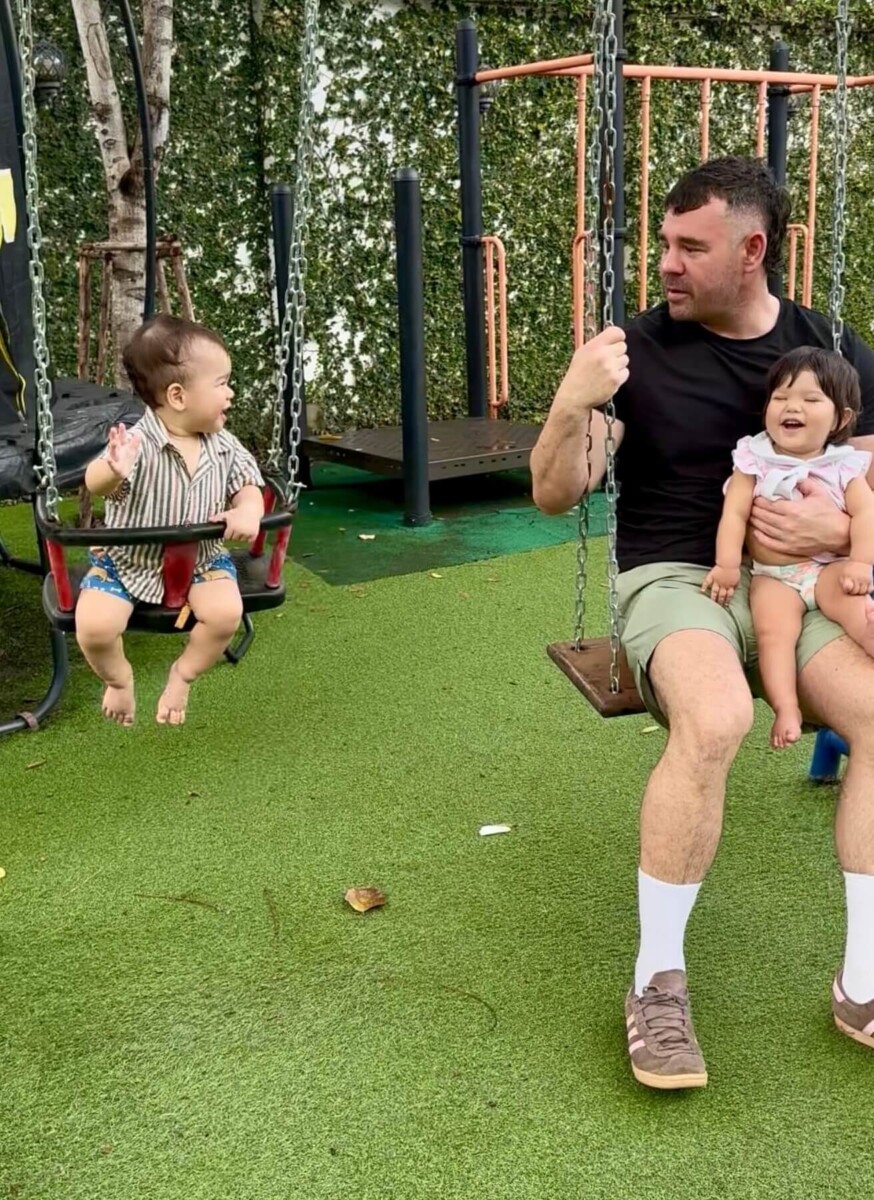 Bart with twins on the swing