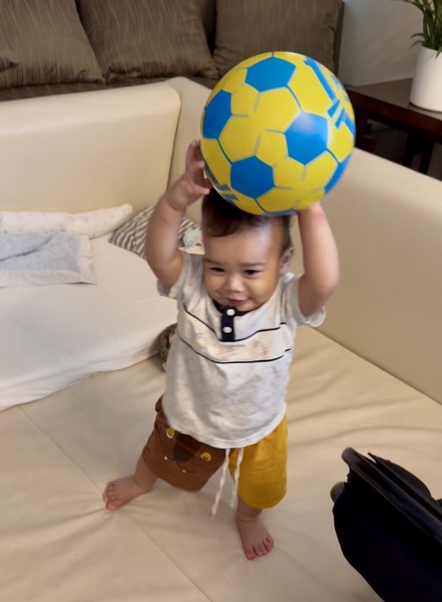 Son Johnny playing with a ball
