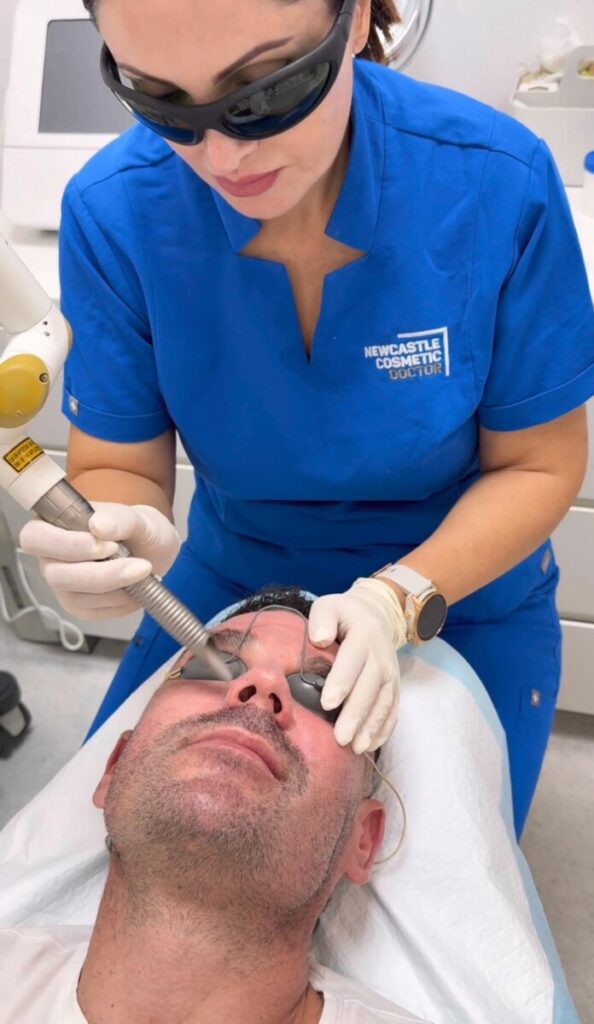 Sharon Leayr performing laser therapy face