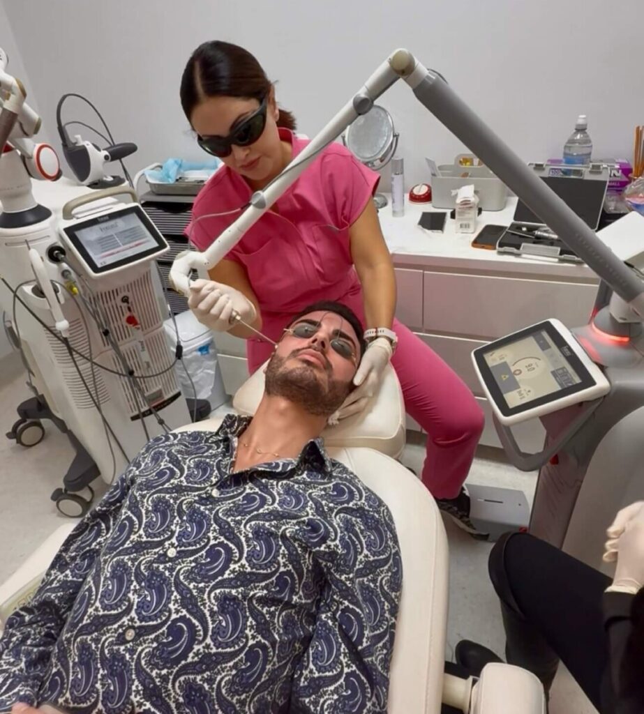 Sharon Leayr treating male patient with laser